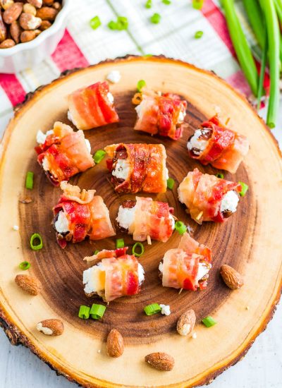 An overhead picture of the finished Bacon Wrapped Dates on a wooden serving tray.