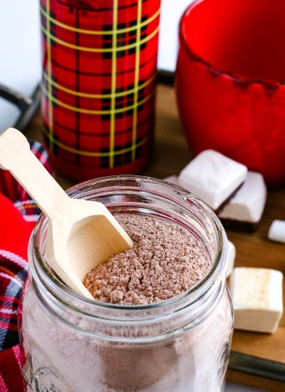 A close up picture of the finished DIY Hot Chocolate Mix Gift in a glass jar.