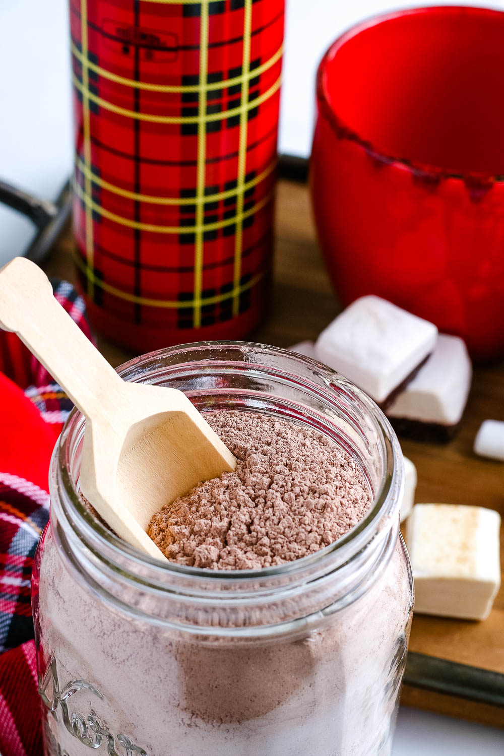 A close up picture of the finished DIY Hot Chocolate Mix Gift in a glass jar. 