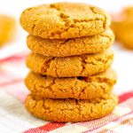 A close up picture of a stack of gingersnap cookies.
