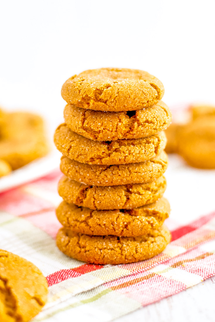 Seven gingersnap cookies stacked on top of each other. 