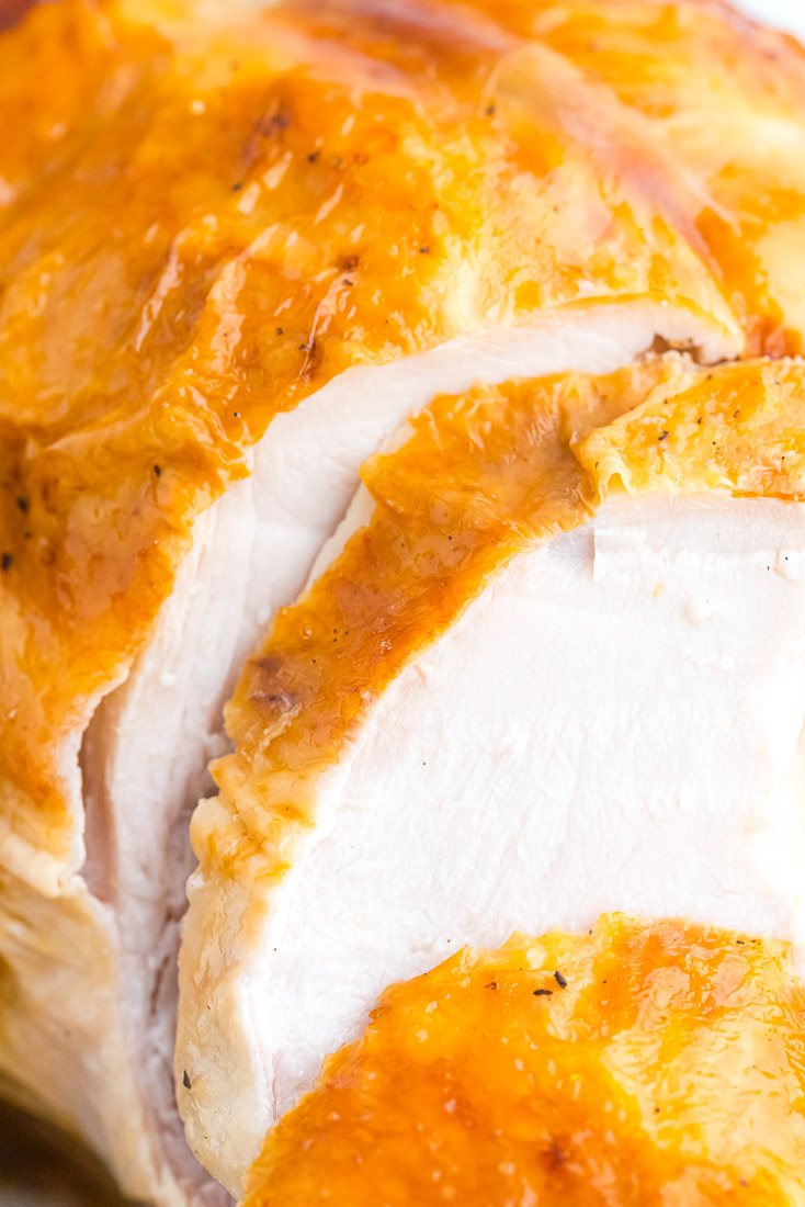 A finished roast turkey being sliced.