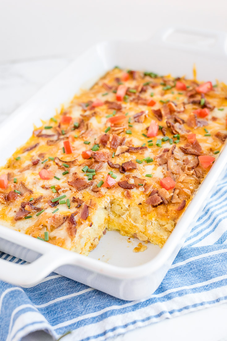The finished Tater Tot Breakfast Casserole with a piece taken out of it.
