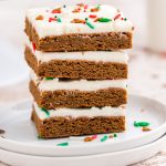 Four Gingerbread bars stacked on top of each other on a white pate.