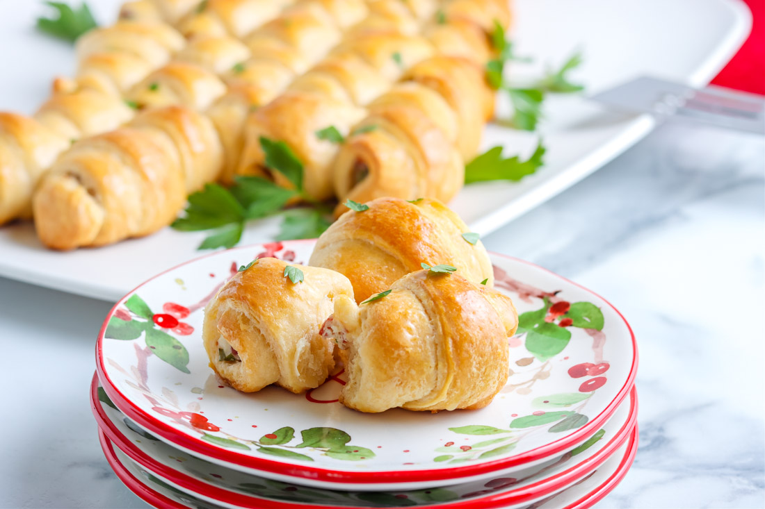 Three pieces of the Crescent Roll Christmas Tree on a serving plate.