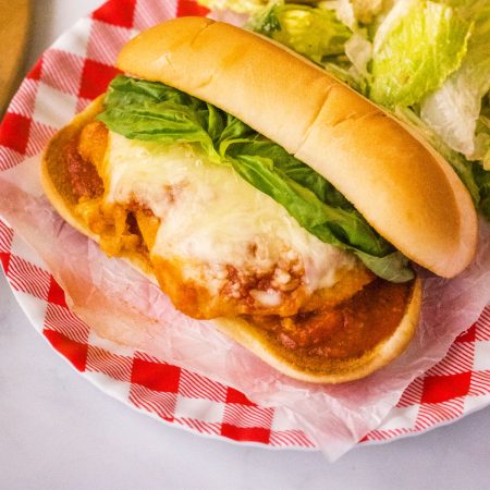 An overhead picture of the finished Chicken Parmesan Sub on a plate.