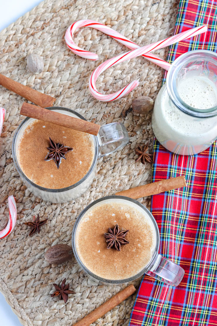An overhead picture of the finished homemade eggnog in glasses.