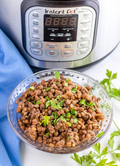 The finished lentils in a bowl infant of an Instant Pot.