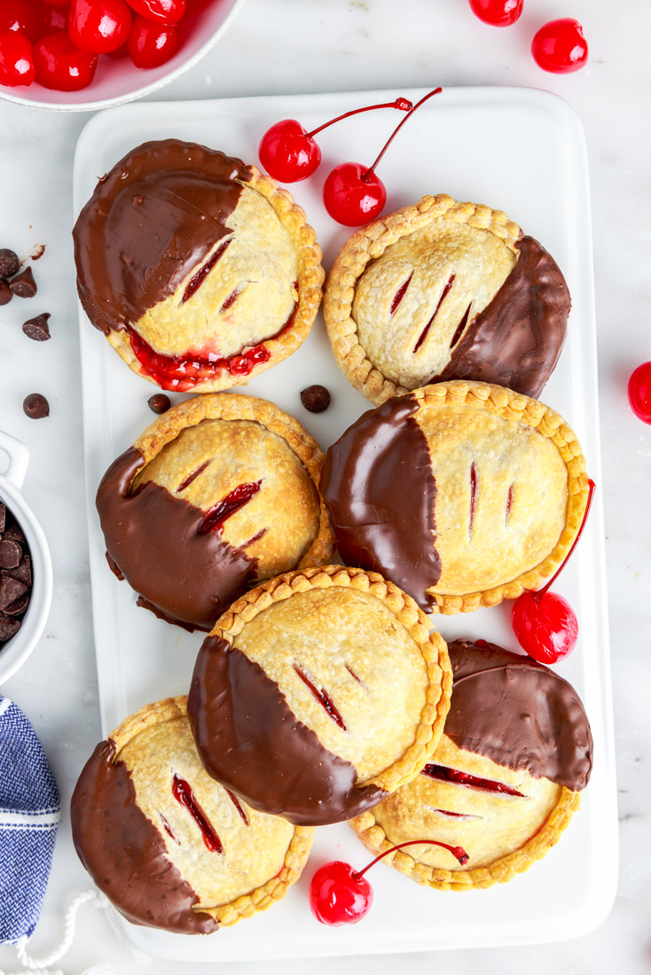 The finished Air Fryer Cherry Hand Pies on a white platter.