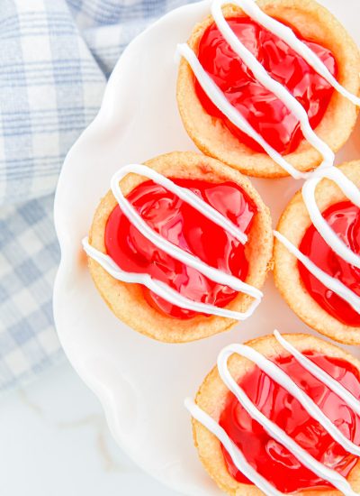A close up picture of Cherry Pie Cookies drizzled with icing.