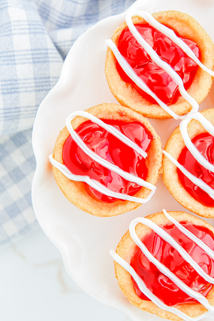 A close up picture of Cherry Pie Cookies drizzled with icing. 