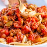 A close up picture of Instant Pot Lentil Bolognese over pasta.