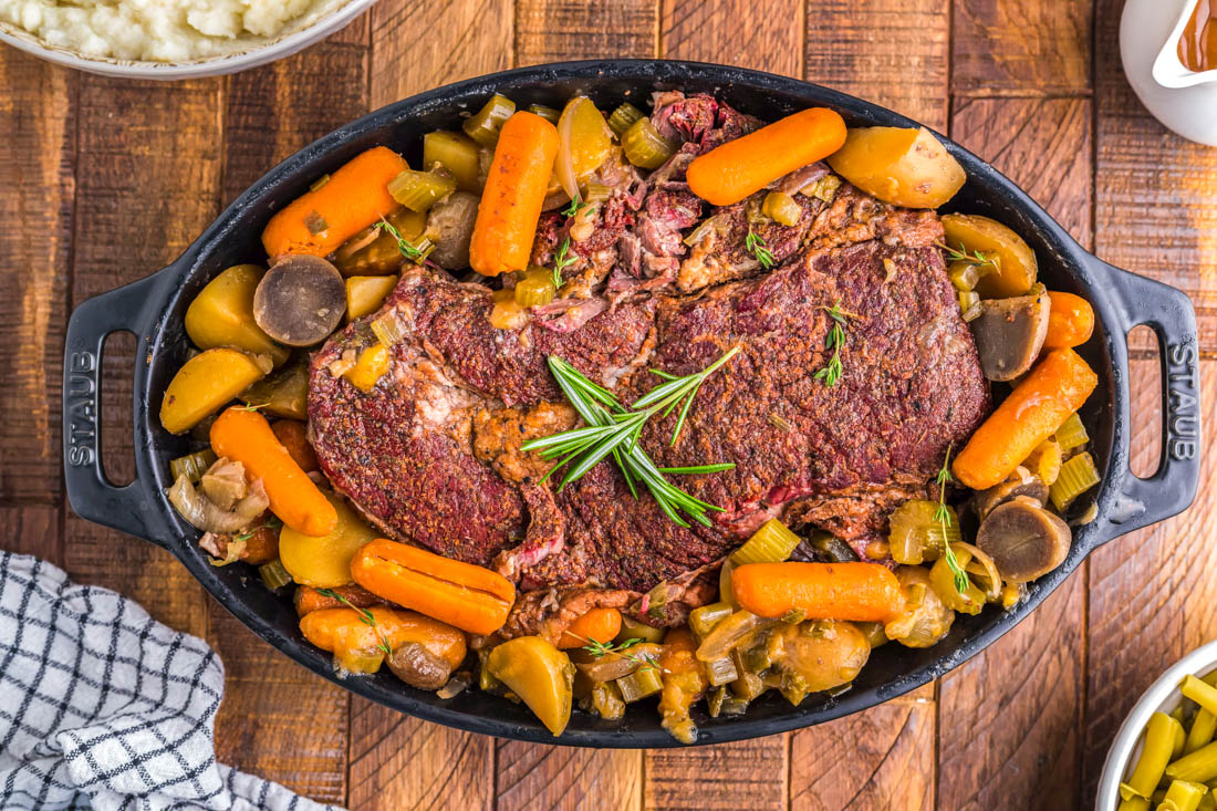 An overhead picture of the finished Smoked Pot Roast on a serving platter.