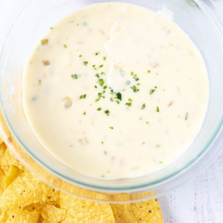 A close up picture of a bowl full of Velveeta cheese quest dip.