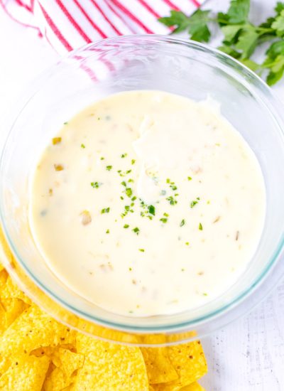 An overhead picture of the finished Velveeta Queso Dip Recipe in a clear glass bowl.