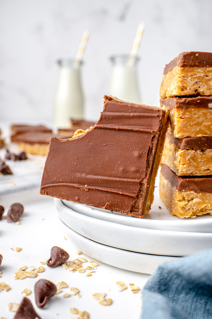 A finished No-Bake Chocolate Peanut Butter Oatmeal Bar with a bite taken out of it.