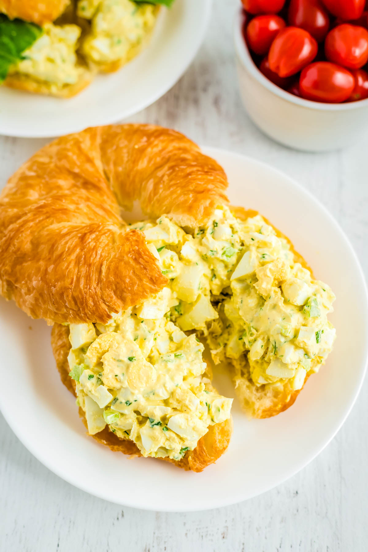 The finished Egg Salad spread on a croissant for a sandwich.