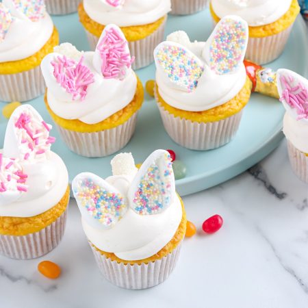 An overhead picture of the finished Bunny Cupcakes on a blue platter.