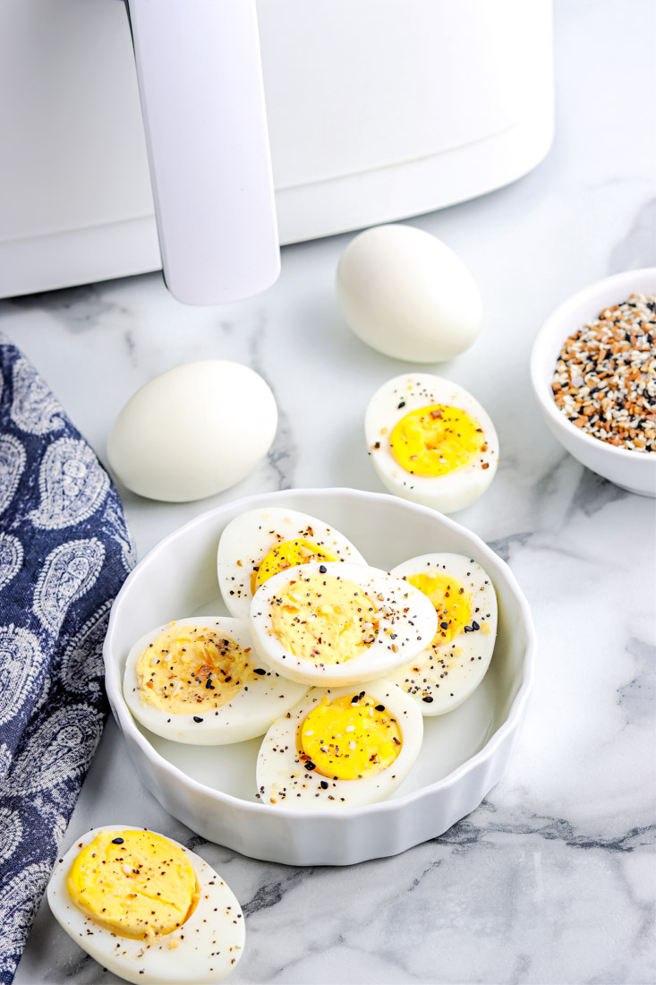 The finished Air Fryer Hard Boiled Eggs cut in half with everything bagel seasoning sprinkled on them.