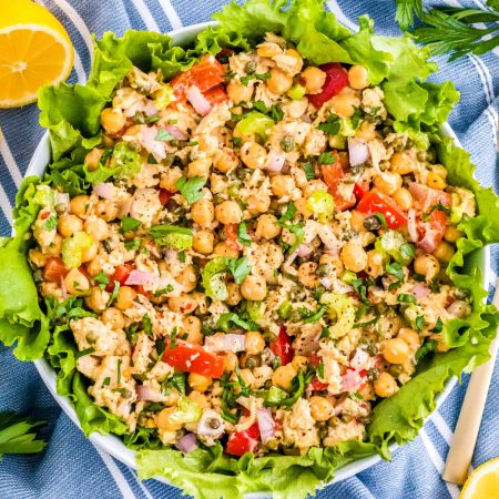 The finished healthy tuna salad recipe made with lemon dressing and not mayo in a white serving bowl.