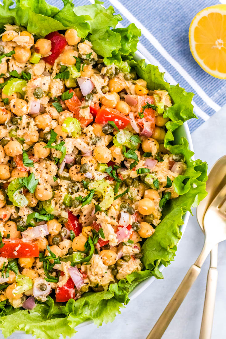 An close up overhead picture of the finished Healthy Tuna Salad Without Mayo on a bead of romaine lettuce.