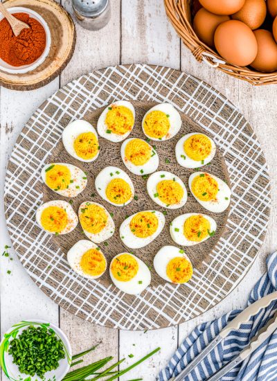 An overhead picture of the finished Horseradish Deviled Eggs on a wooden platter.