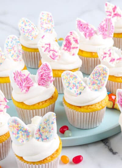 The finished Bunny Cupcakes recipe on a blue platter.