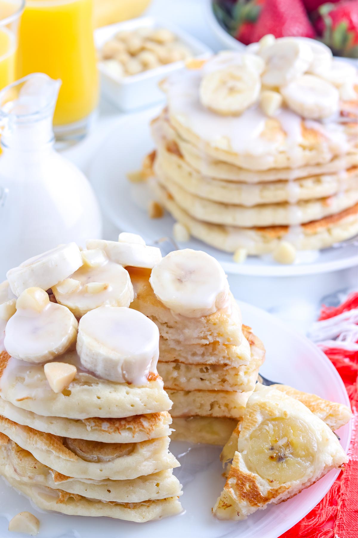 A stack of the finished Banana Pancakes cut into so you can see the bananas inside of them and what the interior of the pancakes loo like.