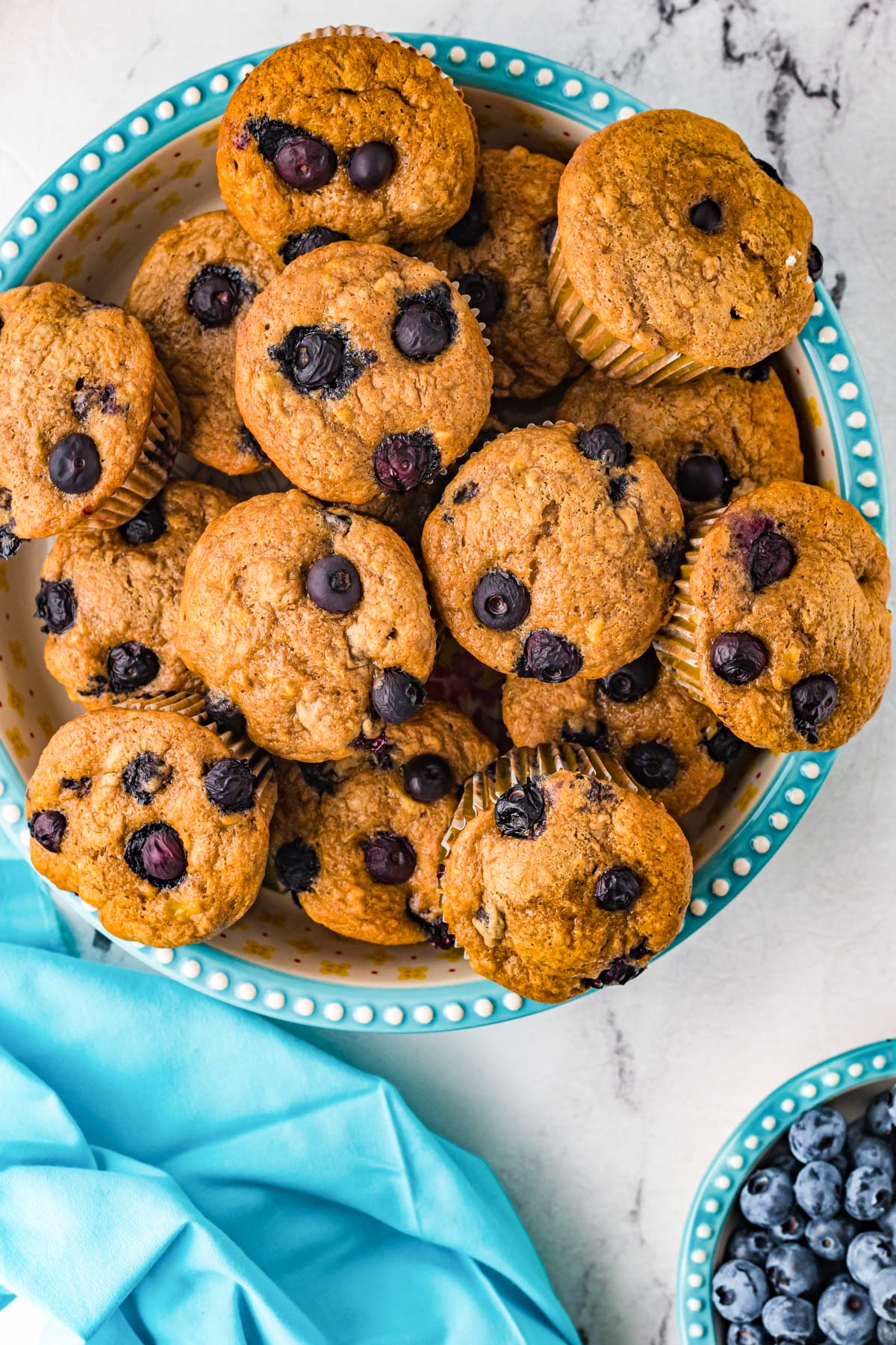 A overhead picture of the finished Blueberry Banana Muffins on a serving platter.