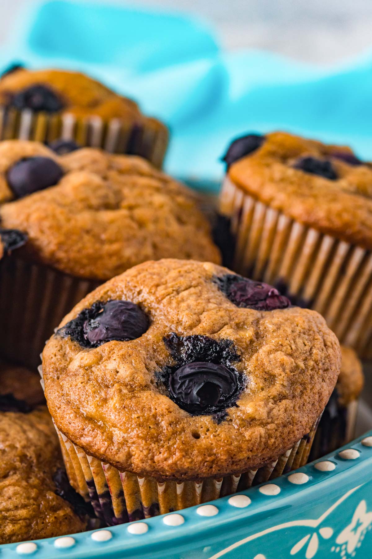 A close up picture of the finished Blueberry Banana Muffins in a serving bowl.