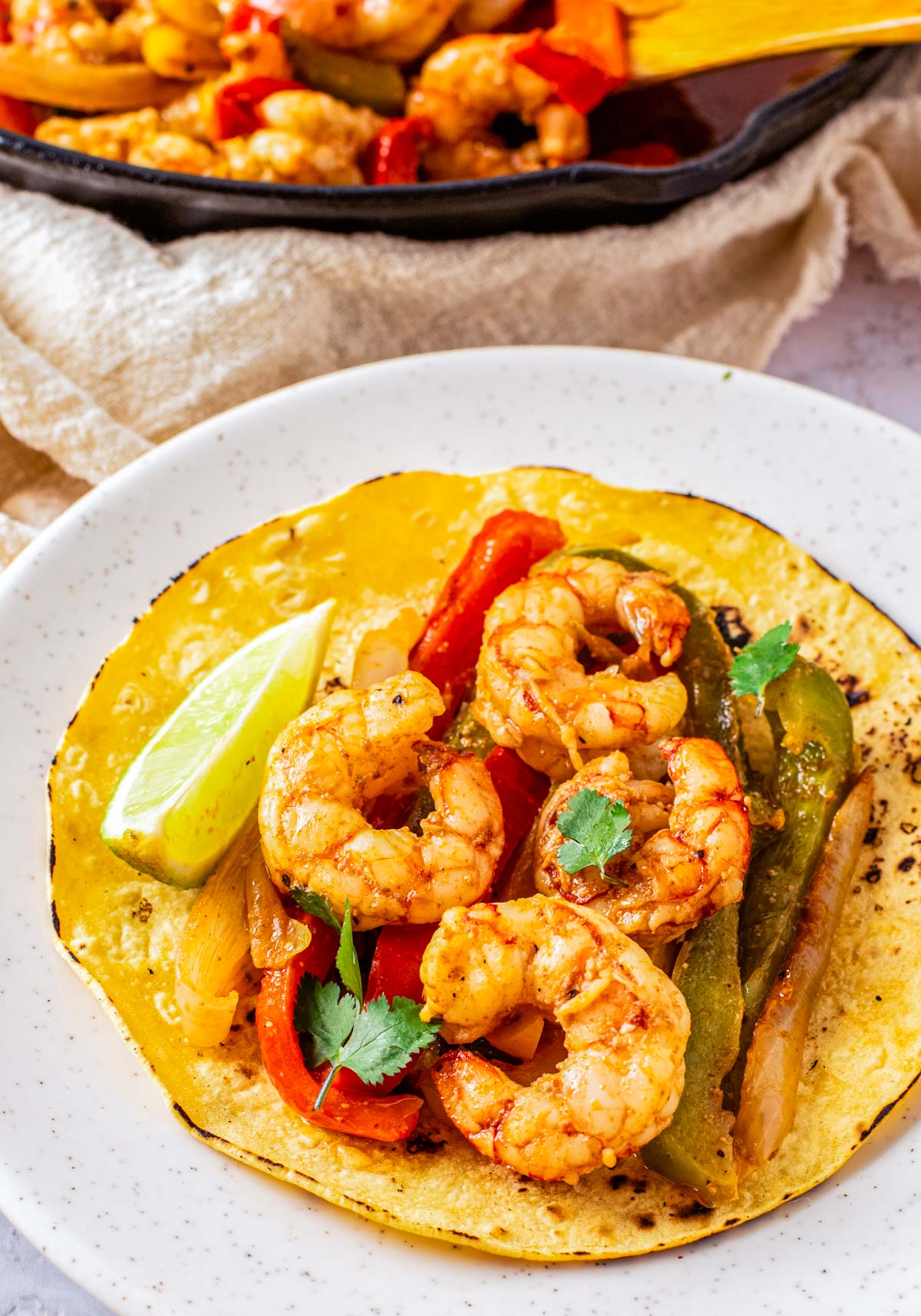 A finished Shrimp Fajita in a corn tortilla.