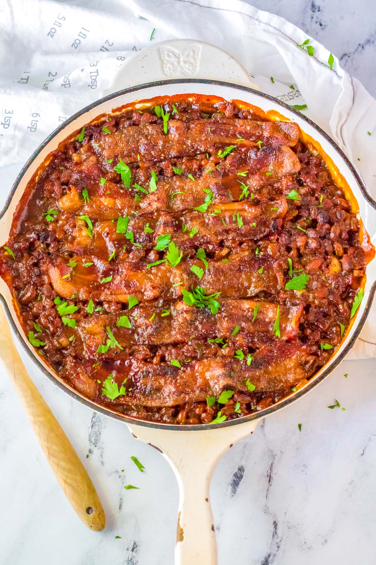 The finished Beefy Baked Beans in the cast iron pan.