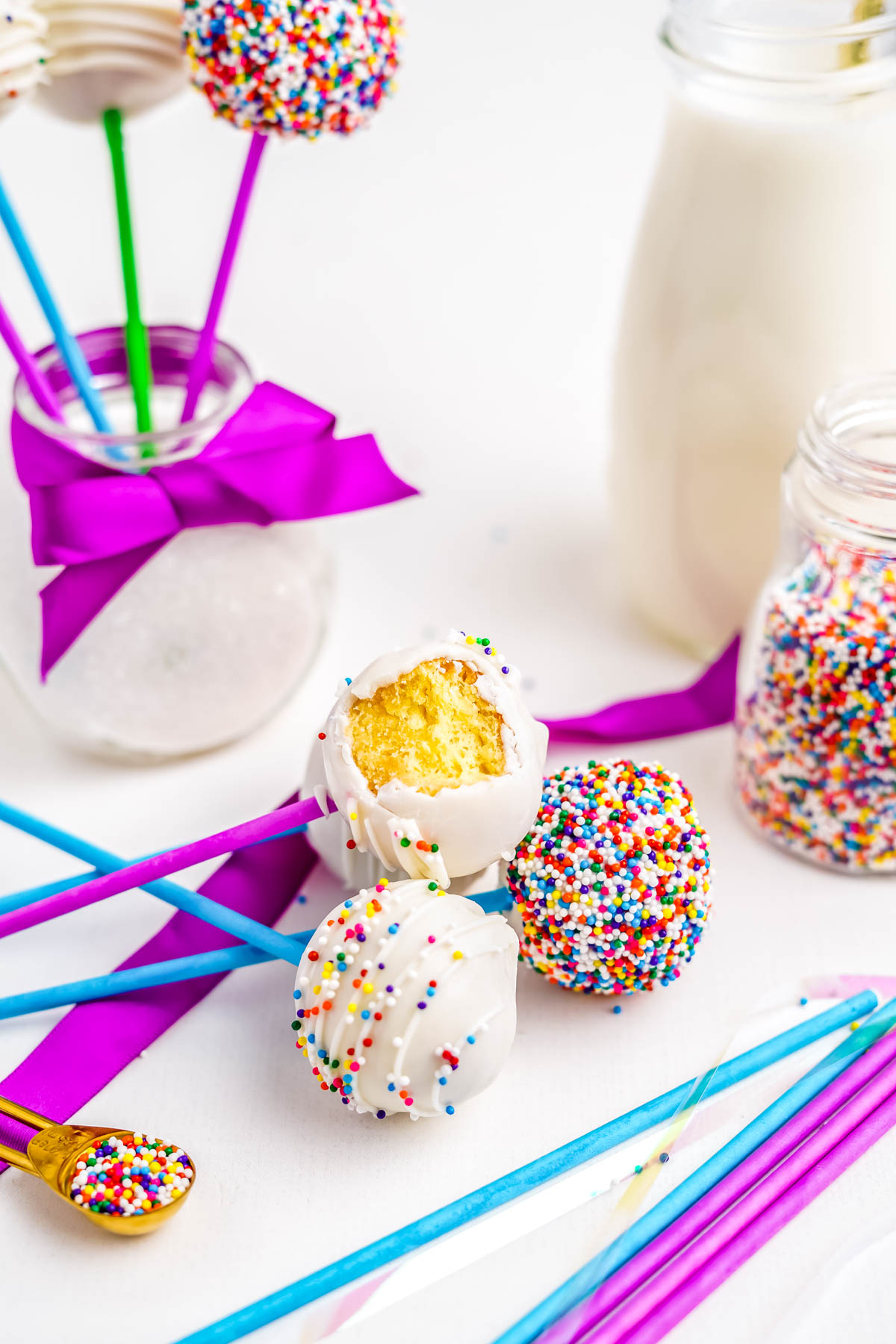 The finished Cake pops made from donut holes lying on a countertop.