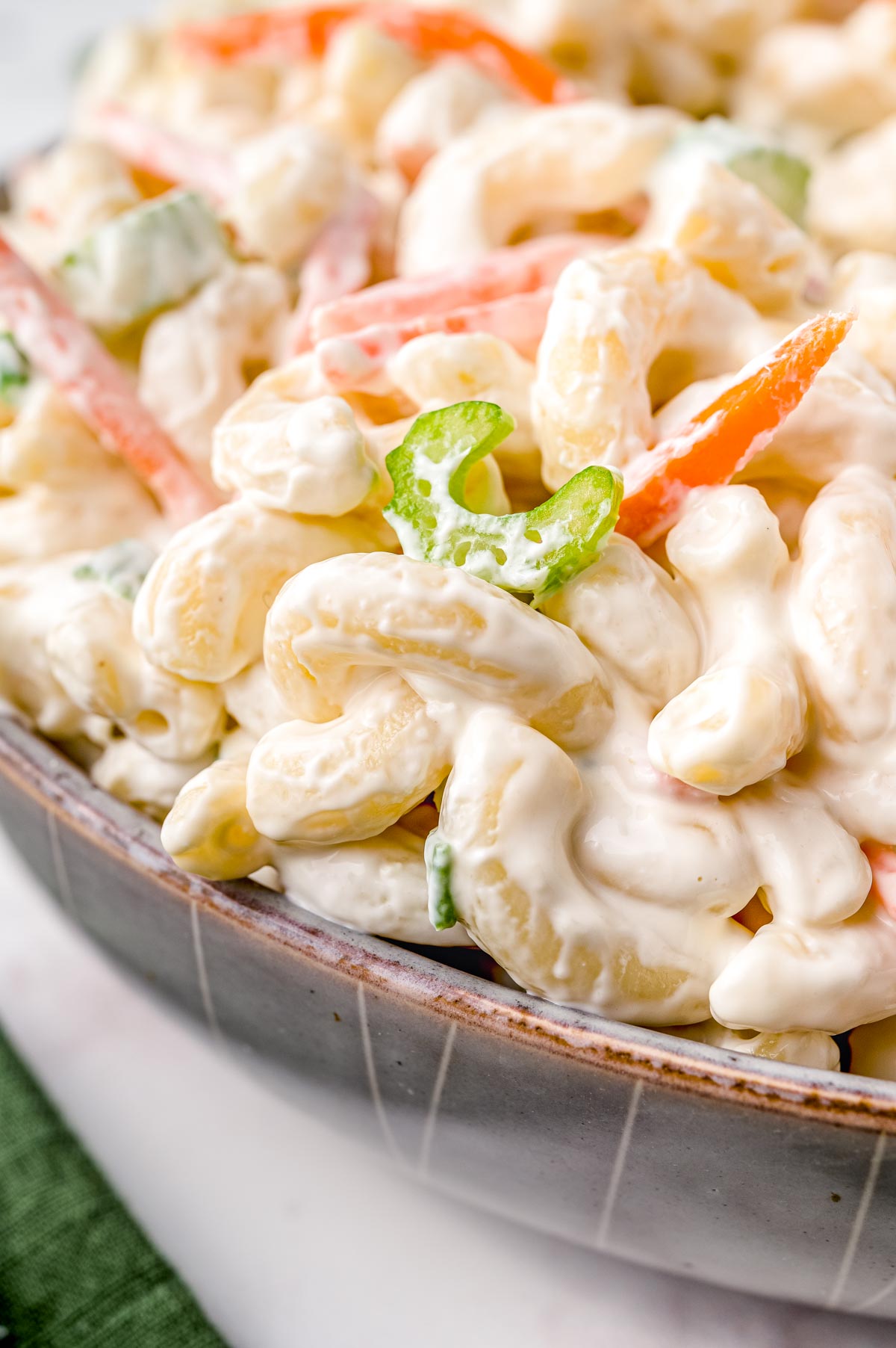 A close up picture of the finished Hawaiian Macaroni Salad in a wooden bowl.