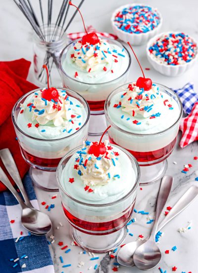 Four of the finished Jello Parfaits decorated with sprinkles.