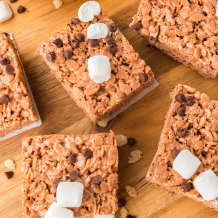 An overhead picture of the finished Chocolate Rice Krispies Treats on a wooden cutting board.