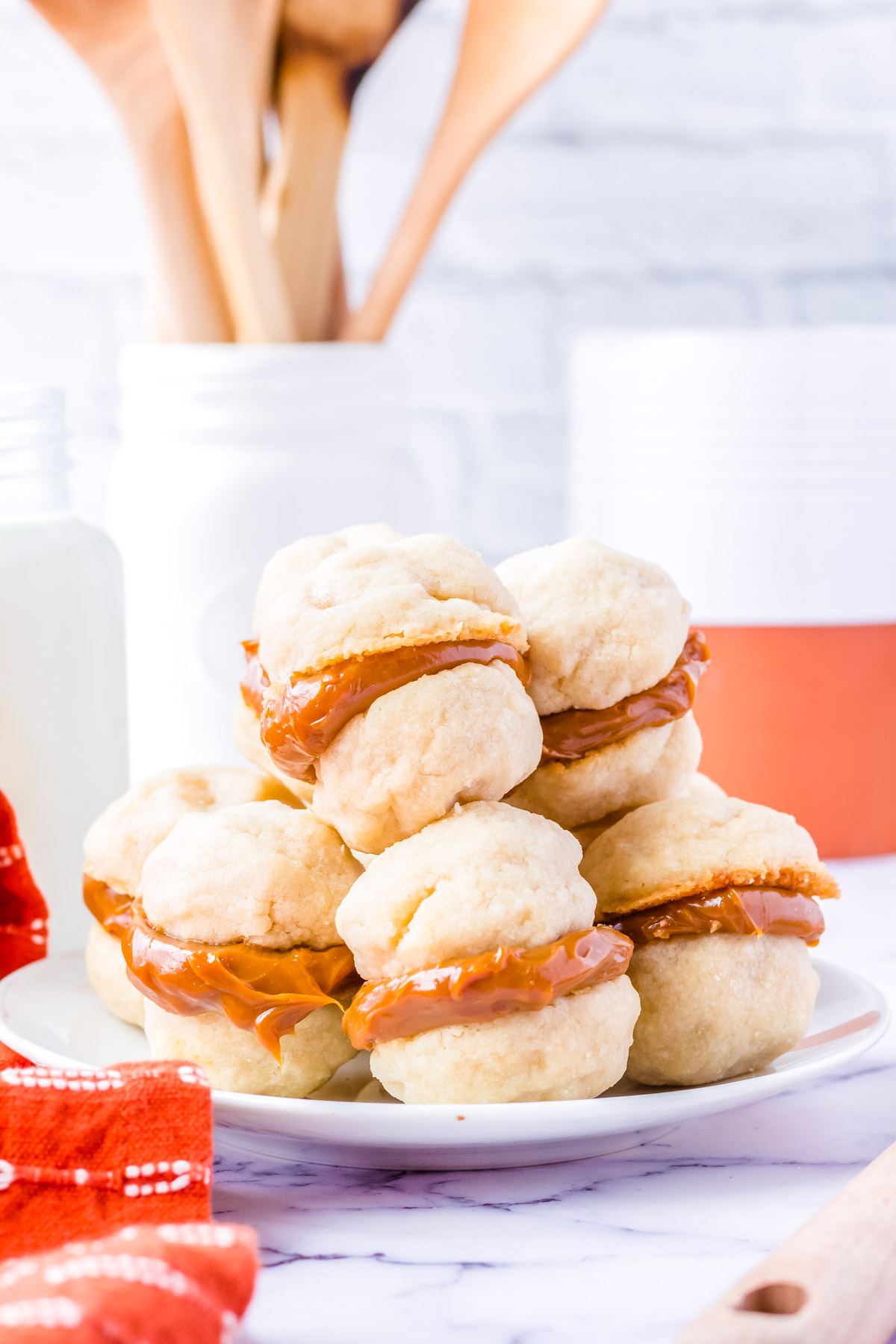The finished Dulce De Leche Cookies on a white platter.
