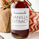 A bottle of Homemade Vanilla Extract in a gifting bottle for the holidays.