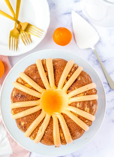 An overhead picture of the finished Orange Creamsicle Bundt Cake on a white platter.