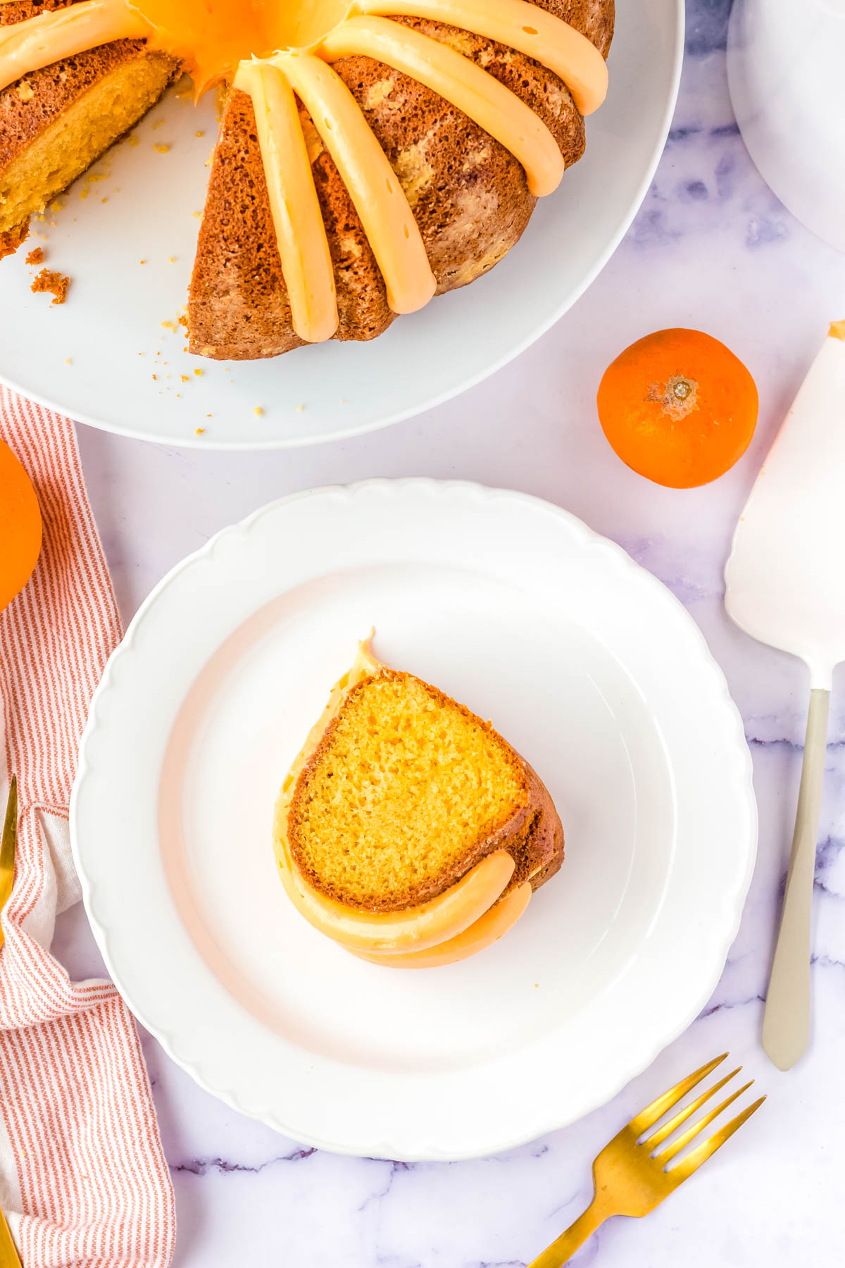A slice of the finished Orange Creamsicle Bundt Cake recipe on a white plate.