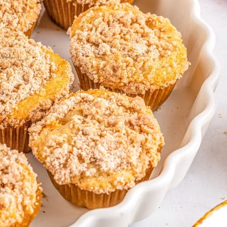 A close up picture of a plate full of the finished apple cinnamon muffin recipe.