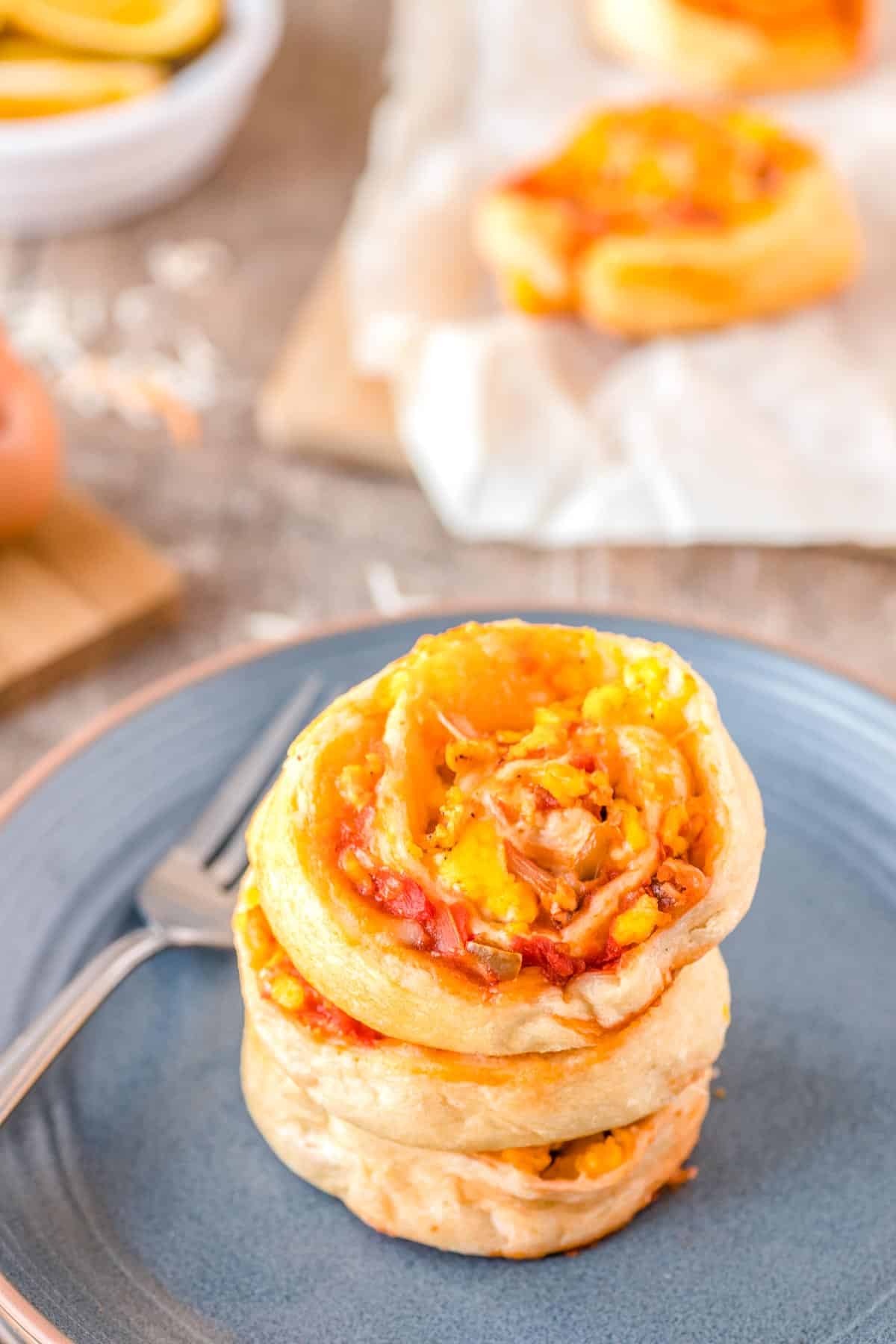 The finished Breakfast Rolls stacked on a plate. 