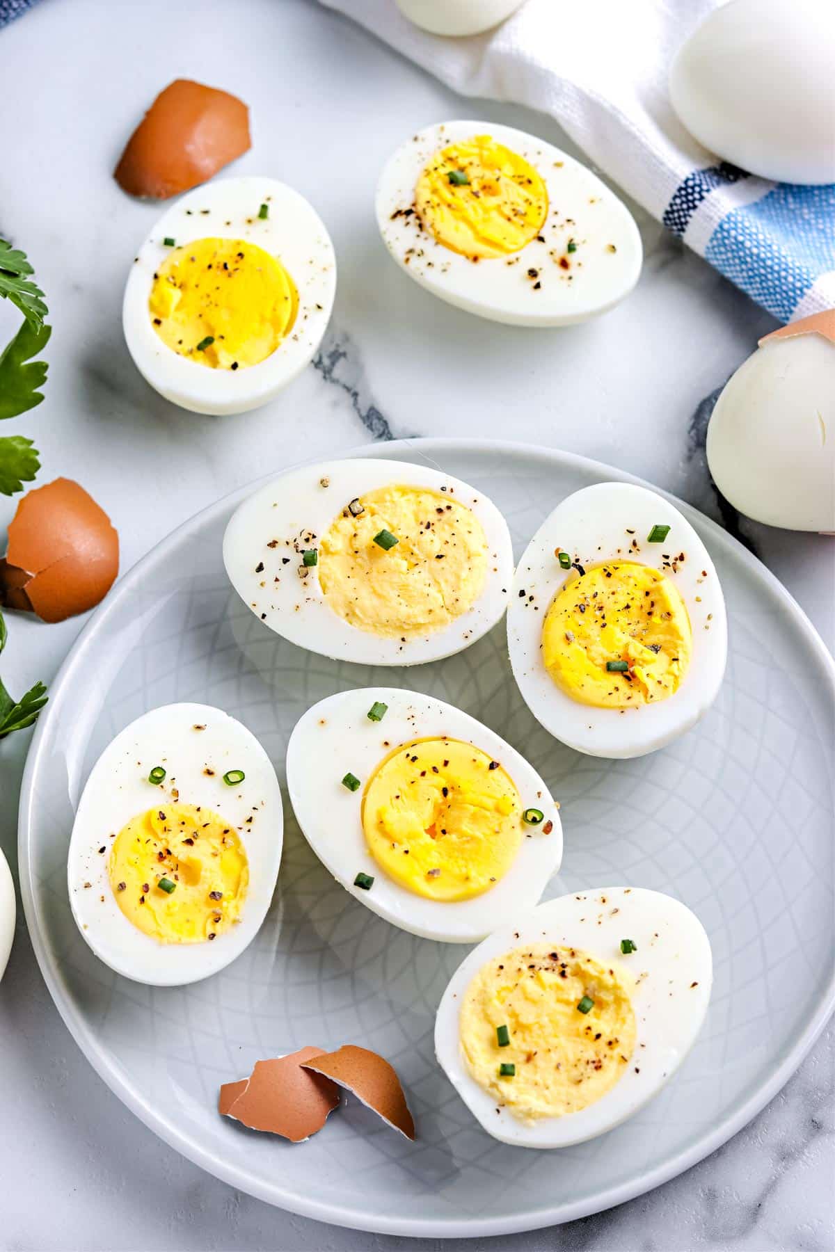 An overhead picture of the finished hard boiled eggs made in an instant pot on a grey plate.