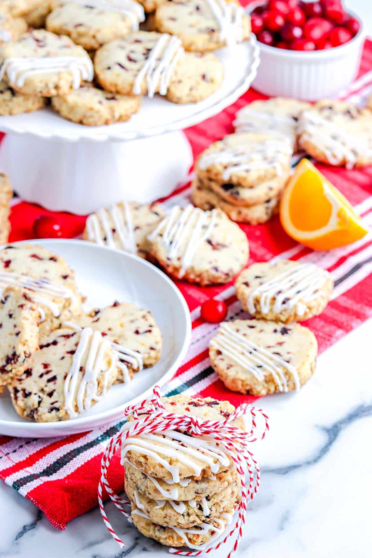The finished Old Fashioned Icebox Cookies stacked on top of each other and on serving plates. 