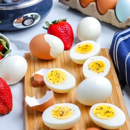 A close up picture of the finished Egg Cooker Hard Boiled Eggs recipe on a wooden serving platter.