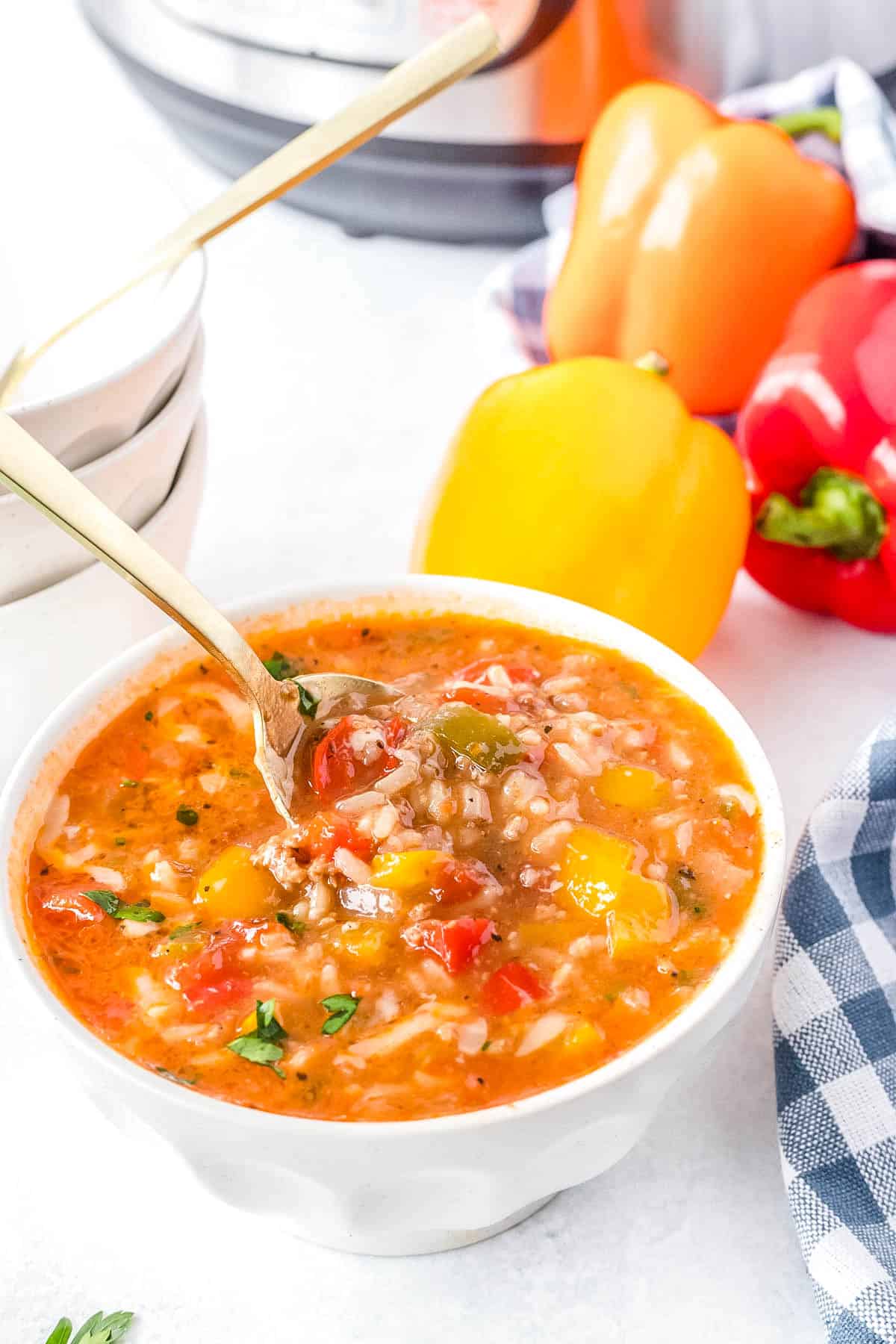 A spoon picking up some of the finished Stuffed Pepper Soup. 