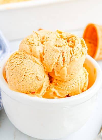 A close up picture of the finished Pumpkin Pie Ice Cream in a white bowl.