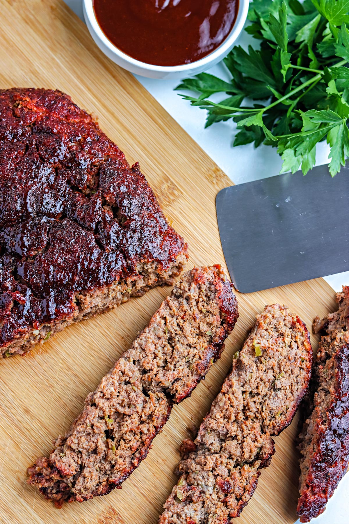 An overhead picture of the finished Smoked Meatloaf on a cutting board.