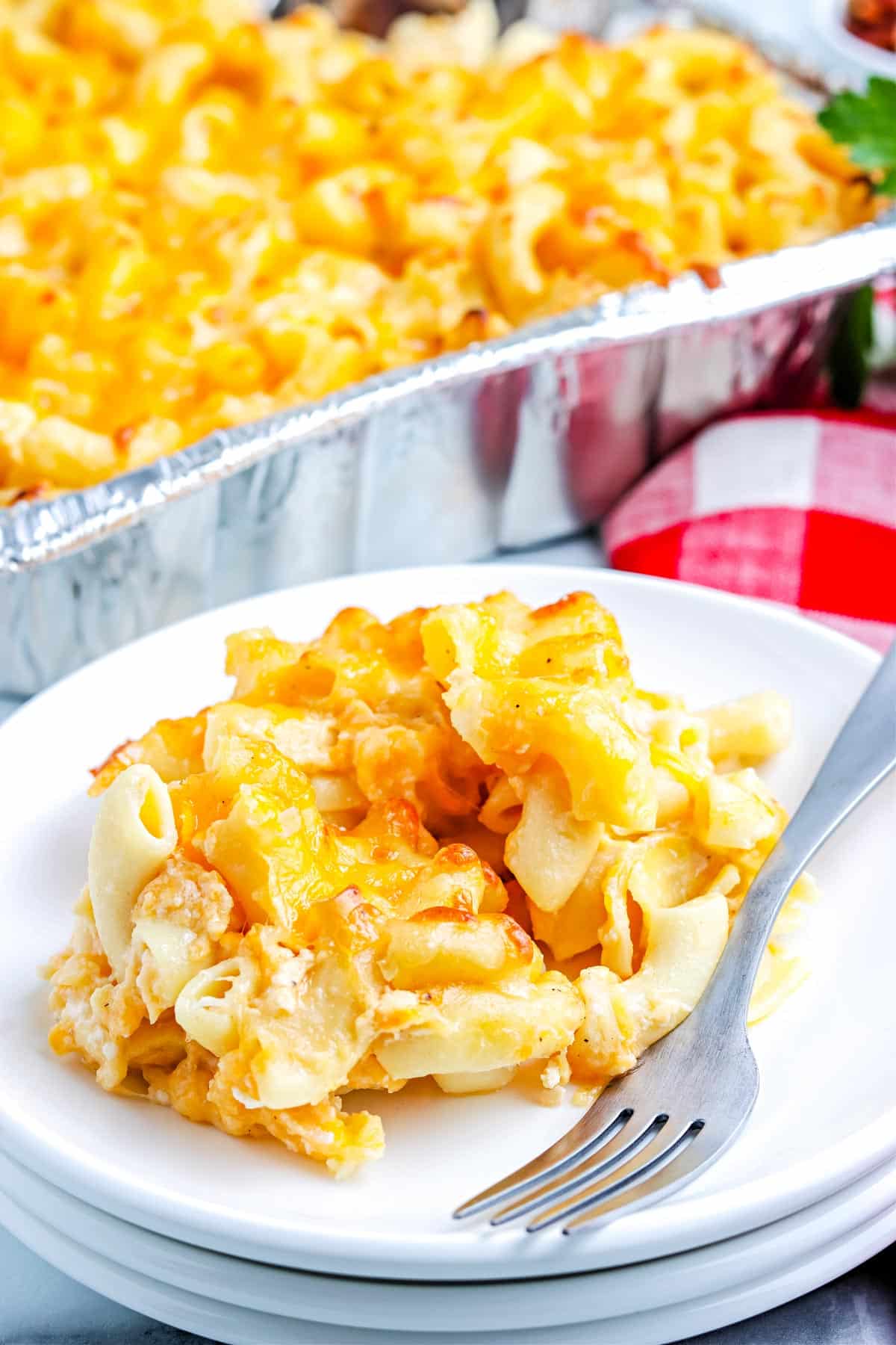 A scoop of the finished Smoked Mac and Cheese on a white plate.