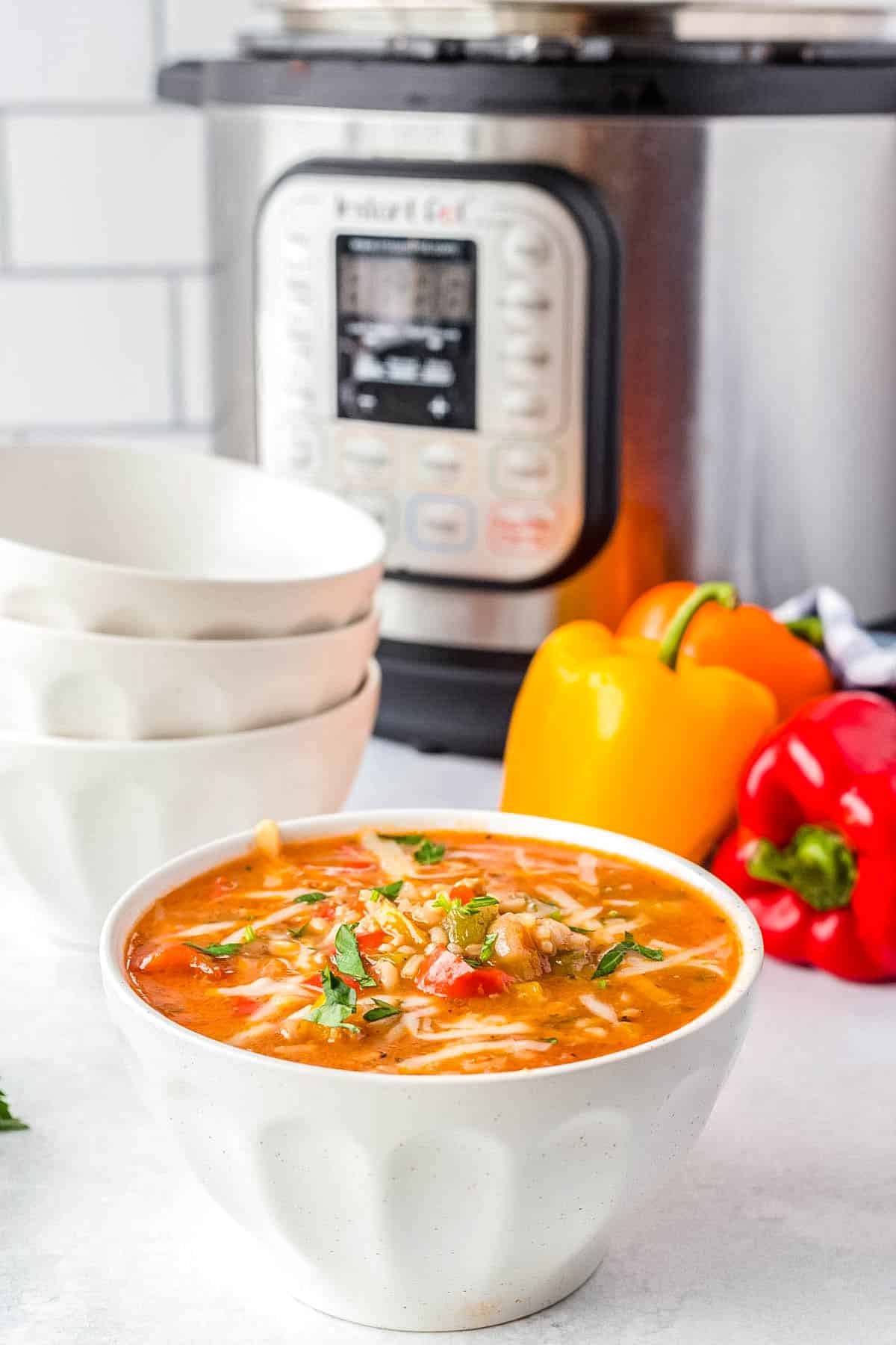 The finished Instant Pot Stuffed Pepper Soup in a white bowl.